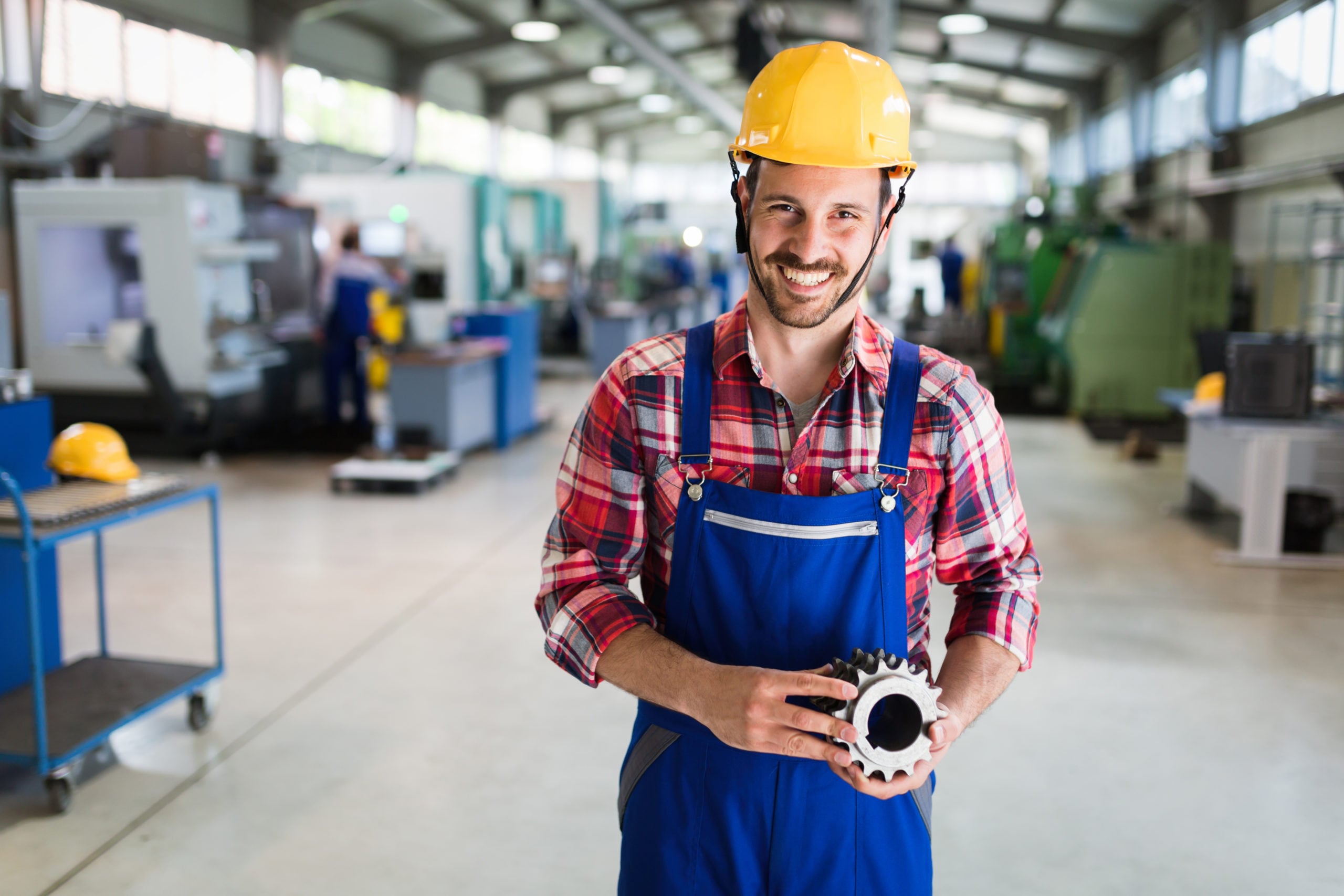 a-portrait-of-handsome-metal-industry-worker-in-fa-8PFMEYU-scaled-1